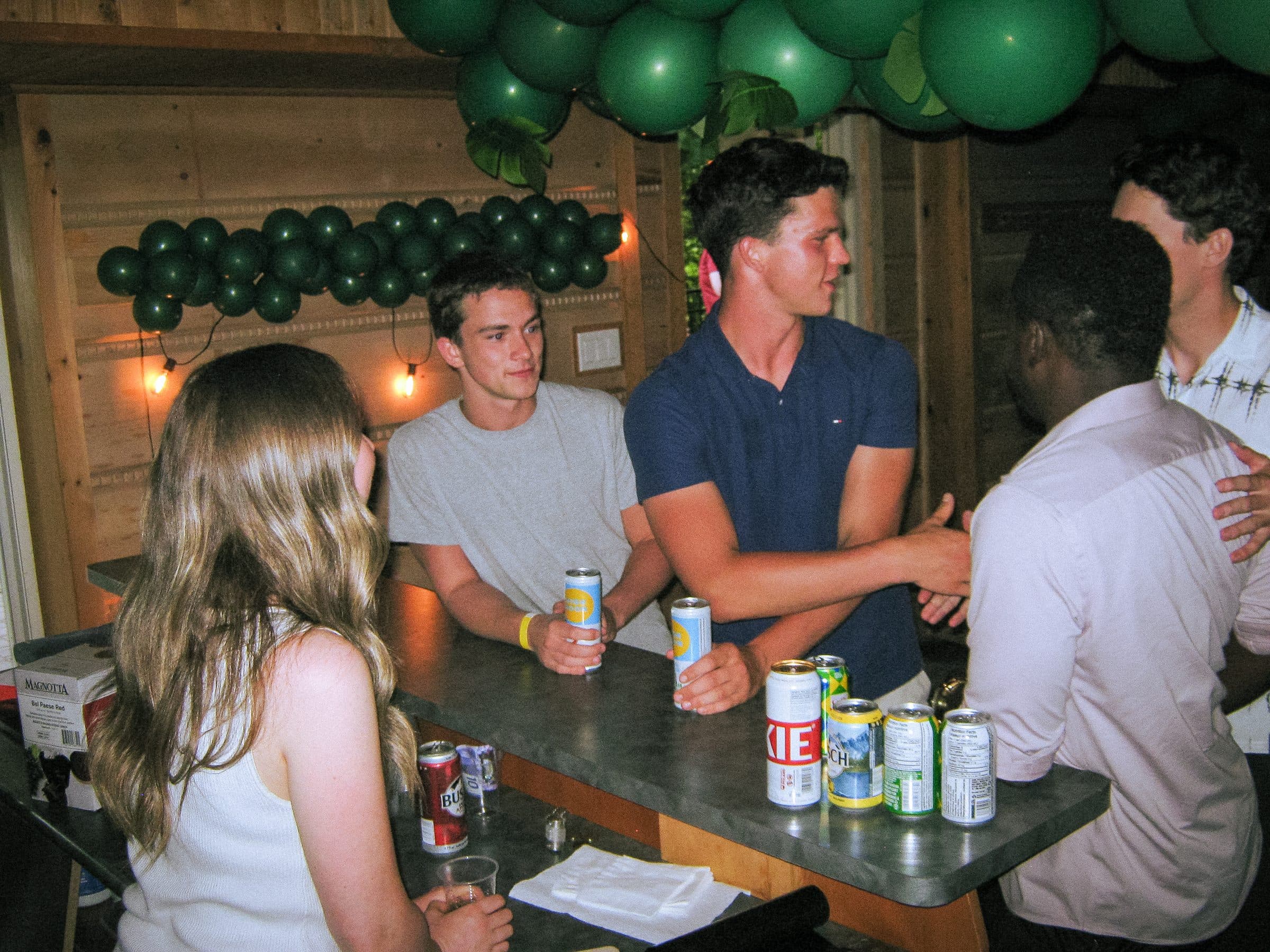 People talking around a table at the Bush Party