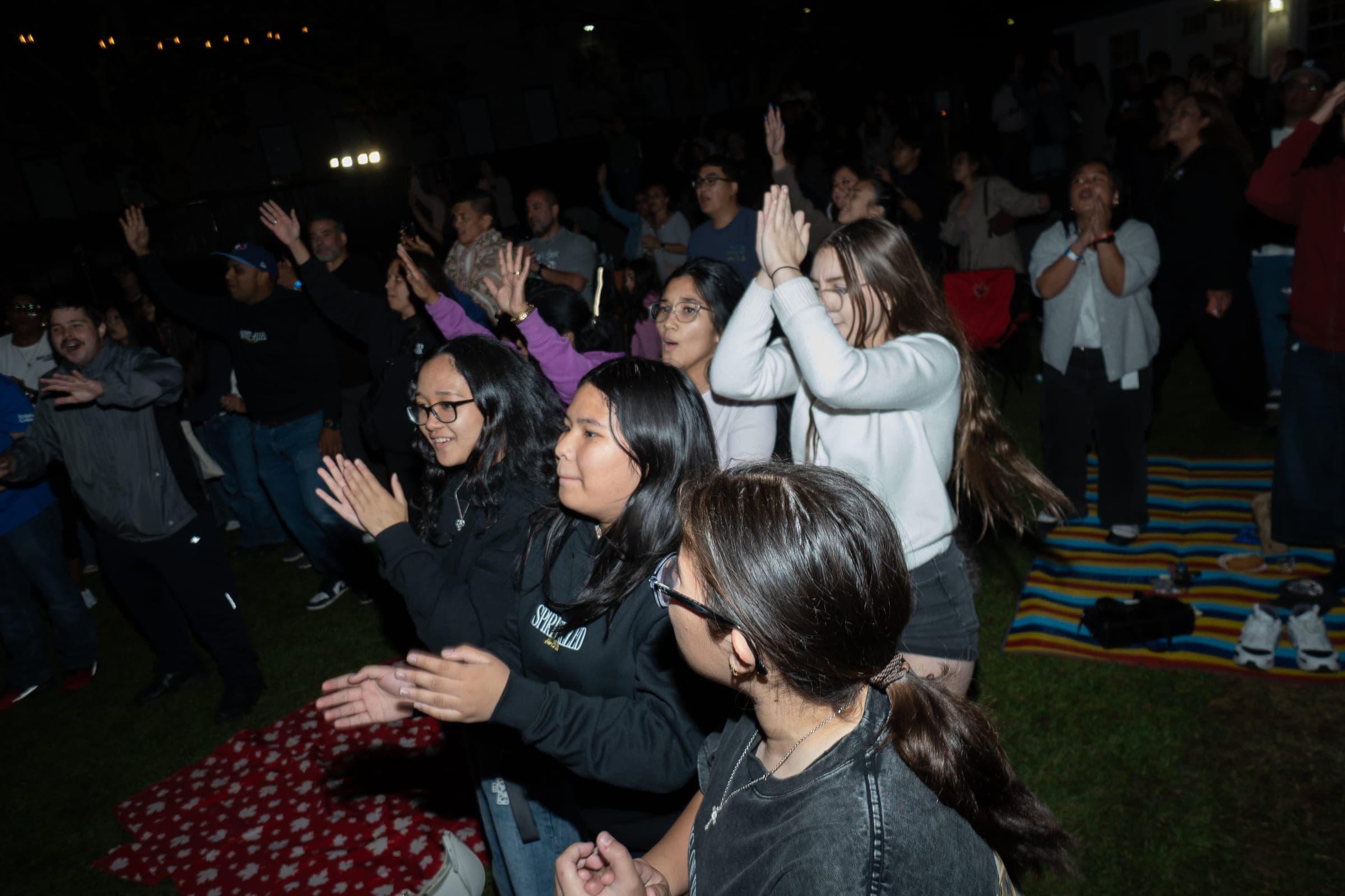 Hands up in the crowd at the front