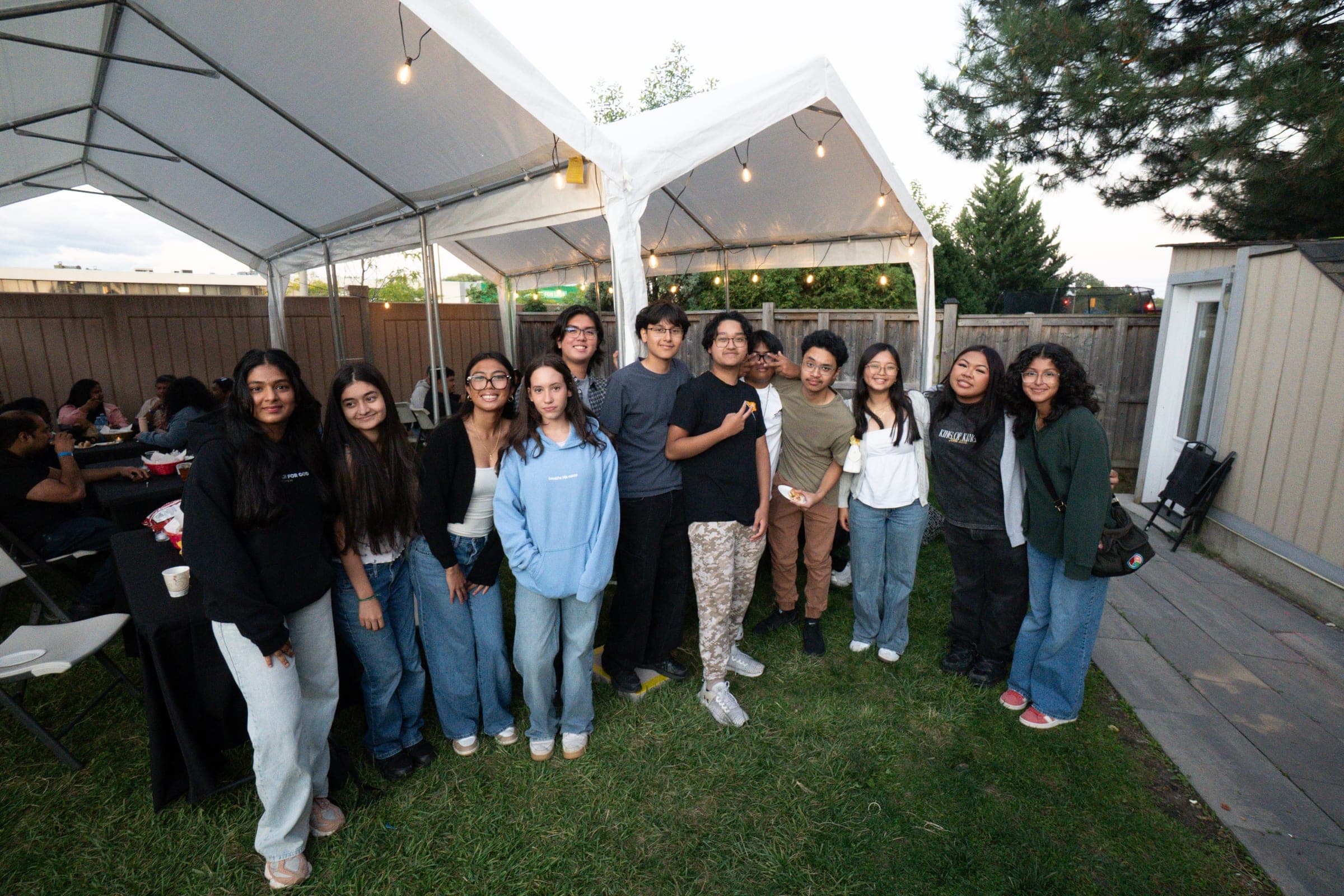 A group together under the marquee