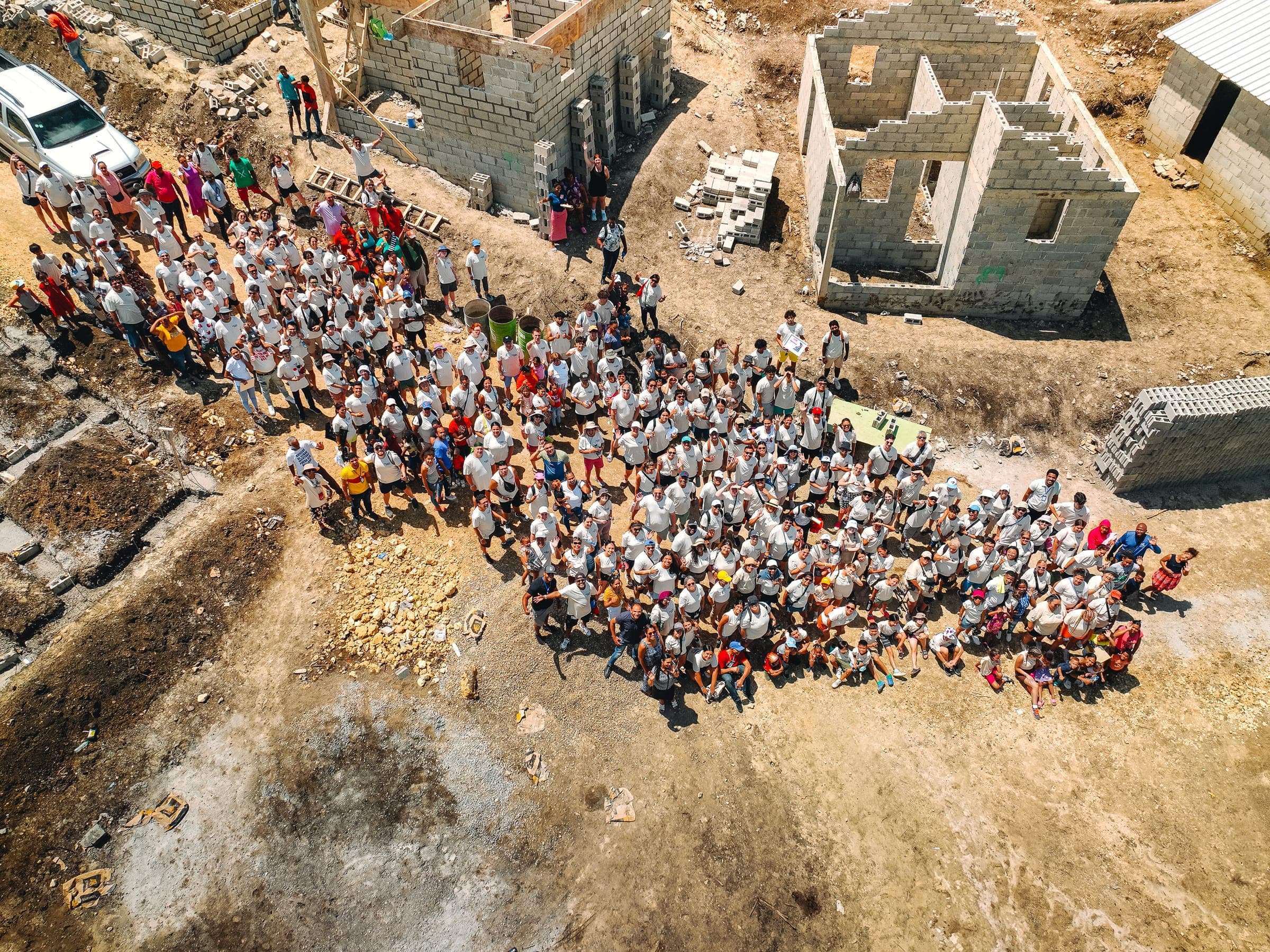 The mission team from above, among the houses they built