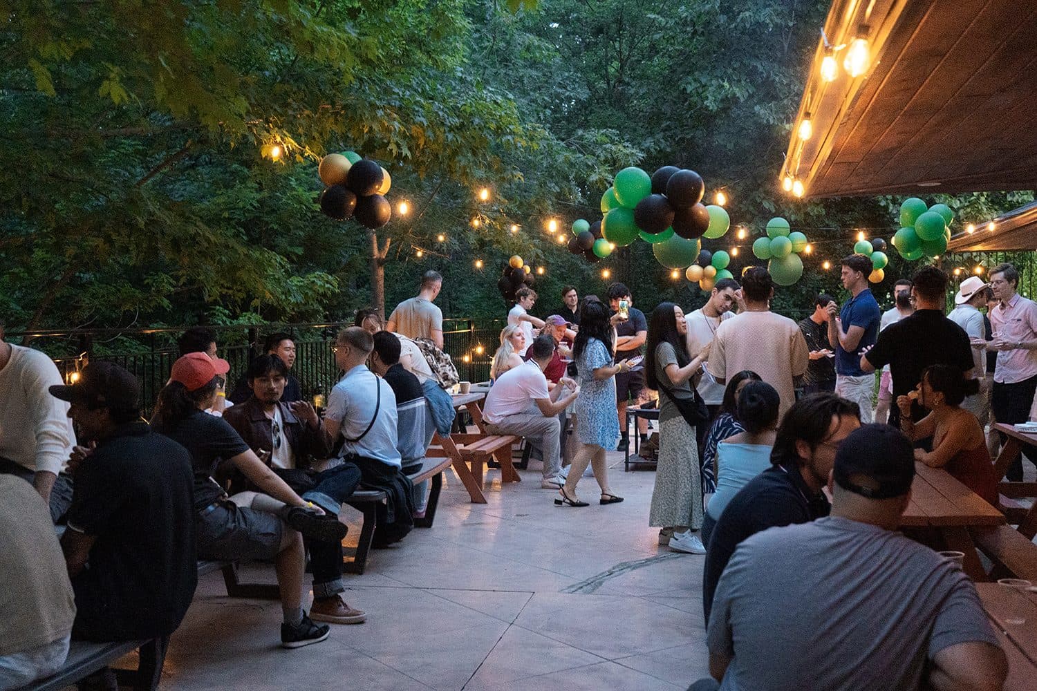The patio under string lights as the night filled up