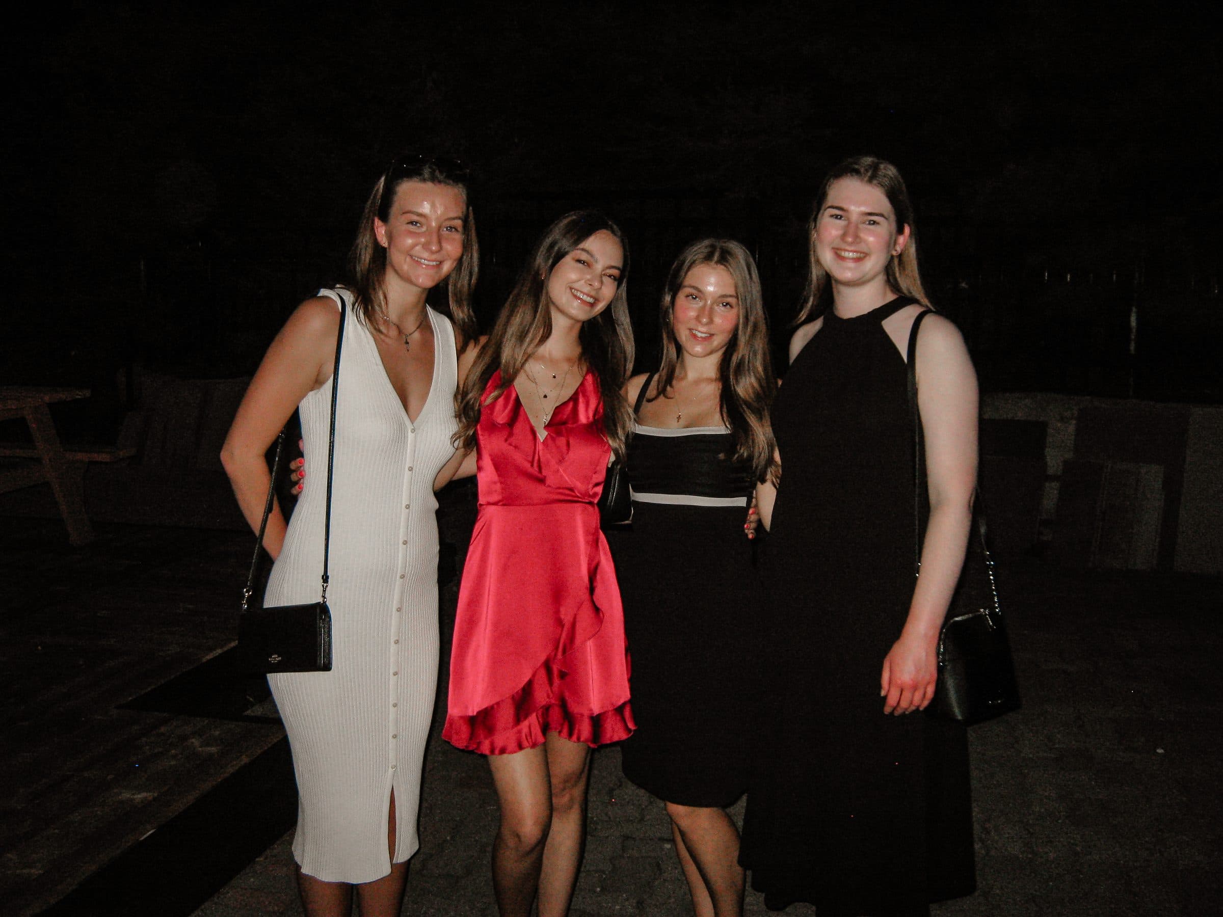 Guests together outside after dark